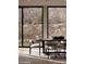 Light and bright dining room with a view of stonework and dessert landscaping at 5000 N Camelback Ridge Rd # 109, Scottsdale, AZ 85251