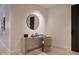 Foyer with modern console table, round mirror and stylish chair creates a welcoming entrance at 5000 N Camelback Ridge Rd # 109, Scottsdale, AZ 85251
