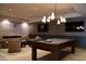 Stylish game room featuring a pool table, comfortable seating, and modern lighting at 5000 N Camelback Ridge Rd # 109, Scottsdale, AZ 85251