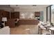 Contemporary kitchen featuring a center island, stainless steel appliances, and access to dining area at 5000 N Camelback Ridge Rd # 109, Scottsdale, AZ 85251