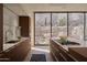 Gourmet kitchen with an island cooktop, stainless steel appliances, and scenic backyard views at 5000 N Camelback Ridge Rd # 109, Scottsdale, AZ 85251