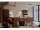 Open-concept kitchen featuring stainless steel appliances and a large center island with seating at 5000 N Camelback Ridge Rd # 109, Scottsdale, AZ 85251