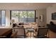 Comfortable living area showcasing contemporary furnishings, floor-to-ceiling windows, and seamless indoor-outdoor living at 5000 N Camelback Ridge Rd # 109, Scottsdale, AZ 85251