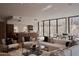 Spacious living area showcasing a modern kitchen, comfortable seating, and seamless indoor-outdoor living at 5000 N Camelback Ridge Rd # 109, Scottsdale, AZ 85251