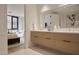 Luxurious bathroom with double vanity, modern fixtures, and seamless flow to the bedroom at 5000 N Camelback Ridge Rd # 109, Scottsdale, AZ 85251