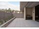 Spacious outdoor patio with built-in grill and concrete walls at 5000 N Camelback Ridge Rd # 109, Scottsdale, AZ 85251