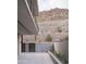 Outdoor patio showcasing beautiful stonework, hillside, and desert landscaping at 5000 N Camelback Ridge Rd # 109, Scottsdale, AZ 85251