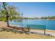 Relaxing lakeside park with a shaded bench for peaceful enjoyment at 5120 N 81St St, Scottsdale, AZ 85250