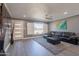 Living room with gray walls, hardwood floors, and a sectional sofa at 5120 N 81St St, Scottsdale, AZ 85250