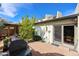 Backyard with patio, landscaping, gas grill, and house with arched window at 5306 N 20Th St, Phoenix, AZ 85016