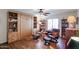 Inviting living space with wood floors, custom built in cabinets and comfortable seating at 5306 N 20Th St, Phoenix, AZ 85016