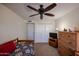 Bedroom with a ceiling fan, a large dresser and a wooden bed frame with a quilt at 5306 N 20Th St, Phoenix, AZ 85016