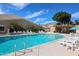 Relaxing community pool surrounded by lounge chairs and greenery, perfect for leisure and recreation at 5306 N 20Th St, Phoenix, AZ 85016