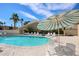Inviting community pool area with ample seating, umbrellas, and well-maintained grounds for resident enjoyment at 5306 N 20Th St, Phoenix, AZ 85016
