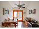 Bright dining area with wooden floors and a sliding glass door to the patio and backyard at 5306 N 20Th St, Phoenix, AZ 85016