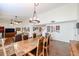 A dining room featuring a large table and chairs, along with tile floors and high ceilings at 5306 N 20Th St, Phoenix, AZ 85016