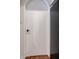 Image features an arched, white door with black hardware, situated next to a black refrigerator at 5306 N 20Th St, Phoenix, AZ 85016