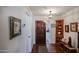 A cozy home entryway features a hardwood floor and decorative wood accents and art at 5306 N 20Th St, Phoenix, AZ 85016