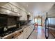 Bright kitchen with stainless steel appliances, white cabinets, dark countertops, and tile floors at 5306 N 20Th St, Phoenix, AZ 85016