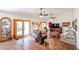Spacious living room with wood-look tile flooring, lots of seating and bright natural light at 5306 N 20Th St, Phoenix, AZ 85016