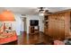 Comfortable living space featuring stylish hardwood floors, built in cabinet and ceiling fan at 5306 N 20Th St, Phoenix, AZ 85016