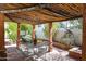 Outdoor patio with pergola covered dining area and mature landscaping at 5306 N 20Th St, Phoenix, AZ 85016