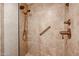 Walk-in shower featuring tile surround, bronze fixtures, and a built in bench at 5306 N 20Th St, Phoenix, AZ 85016