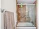 Tiled shower and tub combination with sliding glass doors and a hand rail at 5306 N 20Th St, Phoenix, AZ 85016