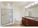 Bathroom with shower, tub, double sink, and vanity with granite countertop at 5450 E Deer Valley Dr # 4015, Phoenix, AZ 85054