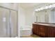 Bathroom with shower, tub, double sink, and vanity with granite countertop at 5450 E Deer Valley Dr # 4015, Phoenix, AZ 85054