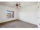A bedroom with ceiling fan and outdoor view from the window at 5450 E Deer Valley Dr # 4015, Phoenix, AZ 85054