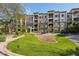 Beautiful condo building showcasing well-maintained landscaping and inviting entrance on a sunny day at 5450 E Deer Valley Dr # 4015, Phoenix, AZ 85054