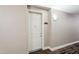 Neutral hallway featuring a white door with unit number 4015 and decorative lighting at 5450 E Deer Valley Dr # 4015, Phoenix, AZ 85054