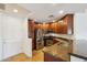 Beautiful kitchen featuring stainless steel appliances, granite countertops, and dark wood cabinets at 5450 E Deer Valley Dr # 4015, Phoenix, AZ 85054