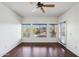 Bright living room featuring hardwood floors, lots of natural light, and a ceiling fan at 5450 E Deer Valley Dr # 4015, Phoenix, AZ 85054