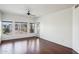 Bright living room featuring hardwood floors, lots of natural light, and a ceiling fan at 5450 E Deer Valley Dr # 4015, Phoenix, AZ 85054