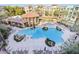 Resort-style pool with ample seating and lush landscaping amid beautiful condo buildings for luxury living at 5450 E Deer Valley Dr # 4015, Phoenix, AZ 85054