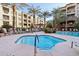 Relaxing hot tub next to a pool with luxurious chaise lounges and swaying palm trees, creating an oasis at 5450 E Deer Valley Dr # 4015, Phoenix, AZ 85054