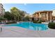 Large community pool with ample lounge chairs and a beautifully designed cabana area for a relaxing atmosphere at 5450 E Deer Valley Dr # 4015, Phoenix, AZ 85054