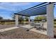 Outdoor kitchen and dining area with pergola at 5933 E Main St # 47, Mesa, AZ 85206
