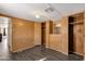 Bedroom with wood-paneled walls and dark wood flooring at 5933 E Main St # 47, Mesa, AZ 85206