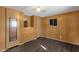 Bedroom with wood-paneled walls and dark wood flooring at 5933 E Main St # 47, Mesa, AZ 85206