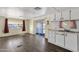 White cabinets, stainless steel appliances, and dark wood floors at 5933 E Main St # 47, Mesa, AZ 85206