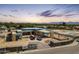 A modern home under construction with a beautiful desert landscape view, driveway, and a clear sky in the background at 6126 E Maverick Rd, Paradise Valley, AZ 85253