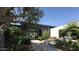 Elegant entryway with water feature and lush landscaping at 6126 E Maverick Rd, Paradise Valley, AZ 85253