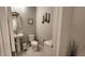 Small bathroom with toilet and pedestal sink at 6455 W Millerton Ct, Florence, AZ 85132