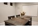 Dining area with table, chairs, and window blinds at 6455 W Millerton Ct, Florence, AZ 85132