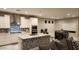 Modern kitchen with white cabinets and a stylish backsplash at 6455 W Millerton Ct, Florence, AZ 85132