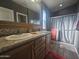 Elegant bathroom with double vanity, large mirror, and a shower at 650 N Hawes Rd # 2709, Mesa, AZ 85207