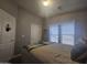 Bright bedroom with full-size bed and double doors at 650 N Hawes Rd # 2709, Mesa, AZ 85207